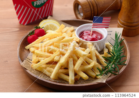 French fries on a wooden plate French fries on a wooden plate 113964524