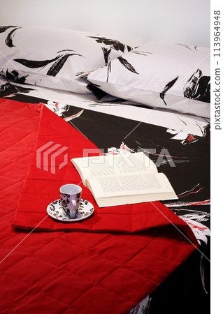 Reading in bed 113964948