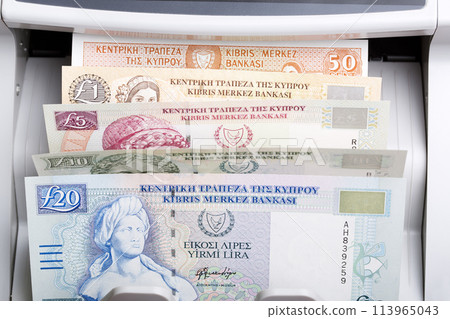 Cypriot pound in a counting machine Cypriot pound in a counting machine 113965043
