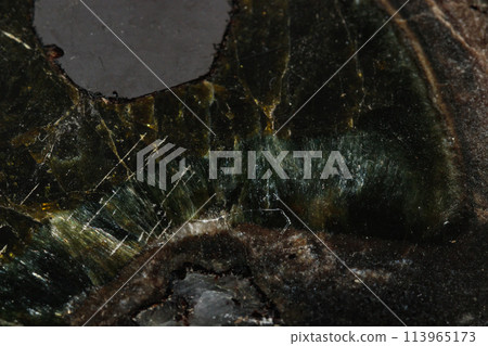 Macro Diopside mineral stone on black background 113965173