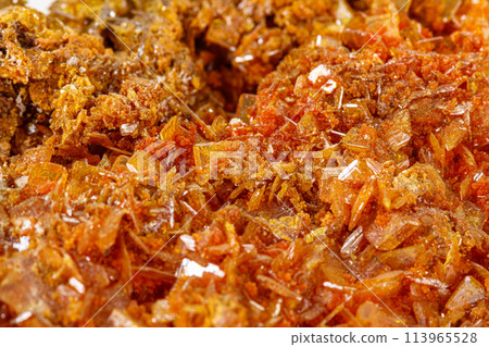 Macro stone mineral Wulfenite on a white background Macro stone mineral Wulfenite on a white background 113965528