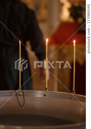 Baptism font for a baby in a church 113966048