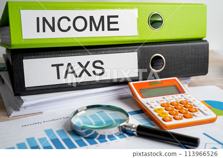 Income and Taxes. Binder data finance report business with graph analysis in office. 113966526