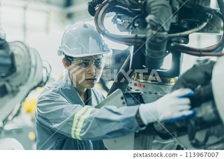 Engineer working machine assembly in advance technology robotic factory industry, Service maintenance robot arm cable part Engineer working machine assembly in advance technology robotic factory industry, Service maintenance robot arm cable part 113967007