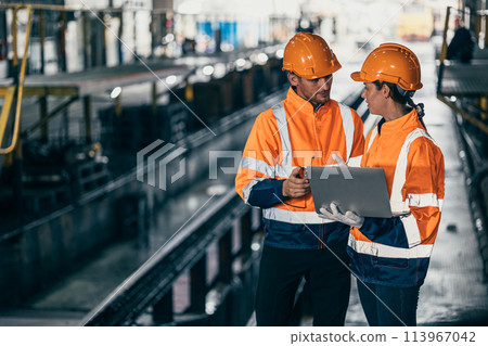 Engineer train engine service team man and women working together at train depot locomotive industry people Engineer train engine service team man and women working together at train depot locomotive industry people 113967042