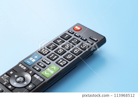 TV remote control on a blue background 113968512