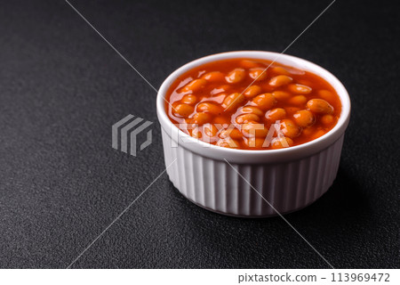Delicious nutritious canned beans in tomato, with salt and spices Delicious nutritious canned beans in tomato, with salt and spices 113969472