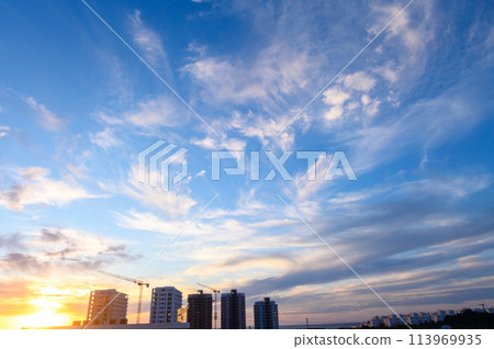 construction site against the background of clouds in the sky during sunset on the Mediterranean 113969935