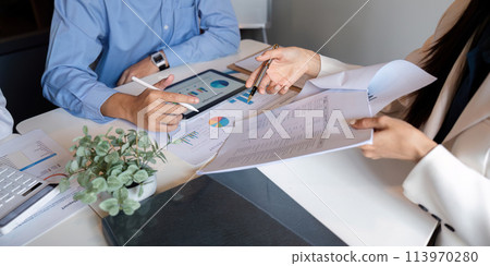 Business team talking planning analyze investment and marketing on tablet, collaboration discussing working analyzing with financial data and marketing business strategy project in office 113970280