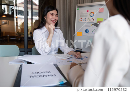 Business team meeting talking planning analyzing investment and marketing on tablet and laptop, discussing with financial data and business strategy, presentation to making profit of company 113970282