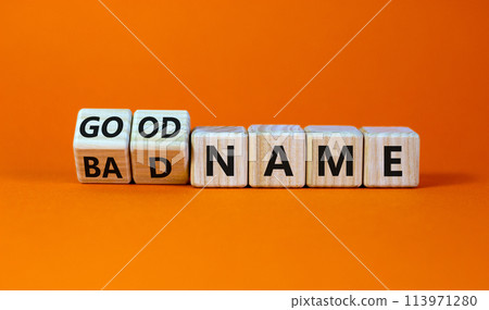 Good or bad name symbol. Turned wooden cubes and changed words 'bad name' to 'good name'. Beautiful orange background, copy space. Business and good or bad name concept. Good or bad name symbol. Turned wooden cubes and changed words 'bad name' to 'good name'. Beautiful orange background, copy space. Business and good or bad name concept. 113971280