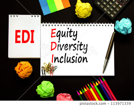 EDI equity diversity inclusion symbol. Concept words EDI equity diversity inclusion on white note. Beautiful black background. Business EDI equity diversity inclusion concept. Copy space. EDI equity diversity inclusion symbol. Concept words EDI equity diversity inclusion on white note. Beautiful black background. Business EDI equity diversity inclusion concept. Copy space. 113971339