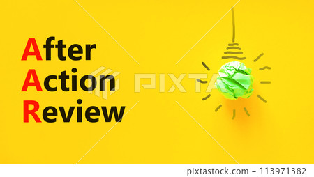 AAR After action review symbol. Concept words AAR After action review on beautiful yellow paper. Beautiful yellow background. Green light bulb. Business AAR after action review concept. Copy space. 113971382