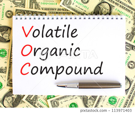 VOC volatile organic compound symbol. Concept words VOC volatile organic compound on beautiful white note. Beautiful dollar bills background. Business VOC volatile organic compound concept. Copy space VOC volatile organic compound symbol. Concept words VOC volatile organic compound on beautiful white note. Beautiful dollar bills background. Business VOC volatile organic compound concept. Copy space 113971403