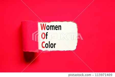 WOC women of color symbol. Concept words WOC women of color on beautiful white paper. Beautiful red paper background. Business WOC women of color social issues concept. Copy space. 113971409