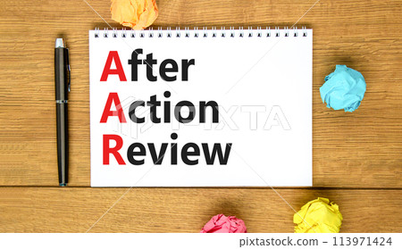AAR After action review symbol. Concept words AAR After action review on beautiful white note. Beautiful wooden table wooden background. Business AAR after action review concept. Copy space. AAR After action review symbol. Concept words AAR After action review on beautiful white note. Beautiful wooden table wooden background. Business AAR after action review concept. Copy space. 113971424