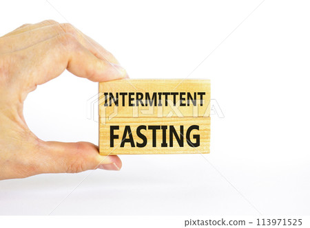 Intermittent fasting symbol. Concept words Intermittent fasting on beautiful wooden block. Beautiful white table white background. Healthy lifestyle intermittent fasting concept. Copy space. Intermittent fasting symbol. Concept words Intermittent fasting on beautiful wooden block. Beautiful white table white background. Healthy lifestyle intermittent fasting concept. Copy space. 113971525