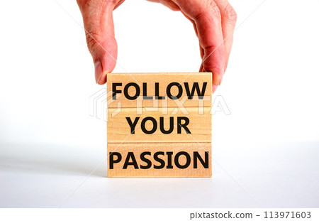 Follow your passion symbol. Concept words Follow your passion on blocks on beautiful white table white background. Businessman hand. Business, motivation and follow your passion concept. Copy space. Follow your passion symbol. Concept words Follow your passion on blocks on beautiful white table white background. Businessman hand. Business, motivation and follow your passion concept. Copy space. 113971603