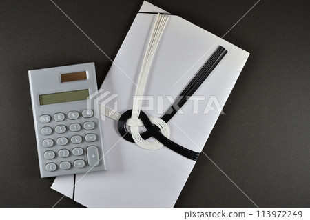 Image of condolence money market rate with condolence envelope and calculator 113972249