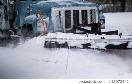Close up of the plow of a snow plow clearing snow Close up of the plow of a snow plow clearing snow 113972441