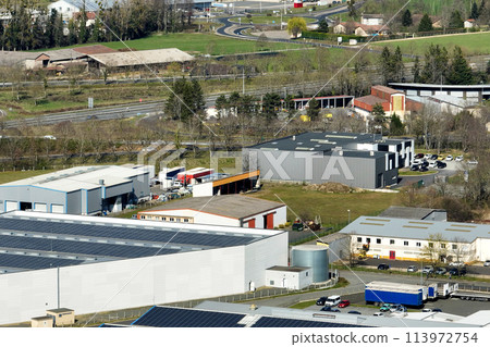 Aerial view of goods warehouses and logistics center in industrial city zone from above 113972754