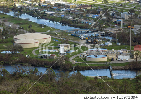 Aerial view of water treatment factory at city wastewater cleaning facility. Purification process of removing undesirable chemicals, suspended solids and gases from contaminated liquid 113972894
