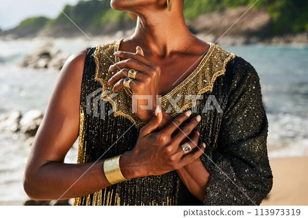 Gender fluid biracial gay hands with jewelry rings, bracelets. Bipoc trans model poses with manicure in closeup. Androgynous drag person touches hands tenderly. Transgender shows his identity. Pride. Gender fluid biracial gay hands with jewelry rings, bracelets. Bipoc trans model poses with manicure in closeup. Androgynous drag person touches hands tenderly. Transgender shows his identity. Pride. 113973319