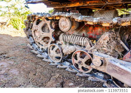 Dirty bulldozer tracks and drive gear. Old crawler rusty tractor Dirty bulldozer tracks and drive gear. Old crawler rusty tractor 113973551