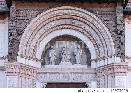 Bologna San Petronio Basilica features a sculptural triad set within a finely carved relief Bologna San Petronio Basilica features a sculptural triad set within a finely carved relief 113973639