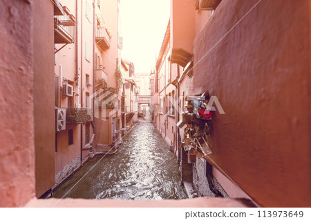 Window with padlocks overlooking Canale delle Moline in Bologna 113973649