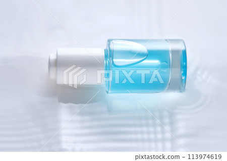 Bottles of serum with a dropper in liquid with pearl tints. Bottles of serum with a dropper in liquid with pearl tints. 113974619