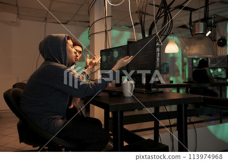 Hackers team planning cyberattack on internet, talking about malicious software code to crack firewall encryption. Online criminals breaking into database, information. Internet fraud. 113974968