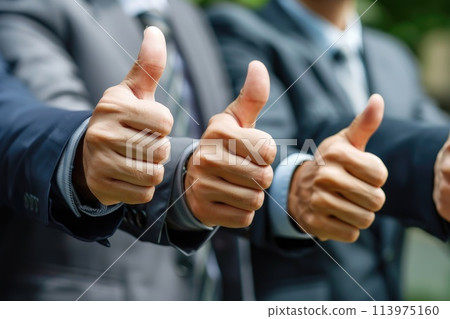 A group of business people are giving thumbs up to each other 113975160