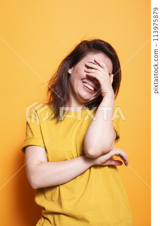 Cheerful adult woman with brunette hair, beaming with happiness through her energetic smile and joyful expression. Perfect for showcasing the vibrant emotions of a happy individual. Cheerful adult woman with brunette hair, beaming with happiness through her energetic smile and joyful expression. Perfect for showcasing the vibrant emotions of a happy individual. 113975879