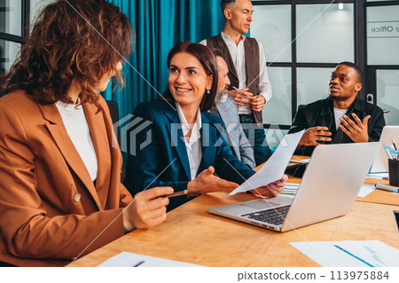 Business people in office work together during a meeting 113975884