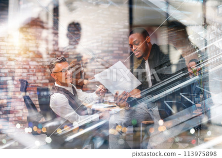 Business people in office work together during a meeting 113975898