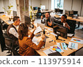 Business people in office work together during a meeting 113975914