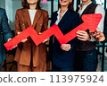 Business teamwork hold a red arrow as growing, successful and profit concept 113975924