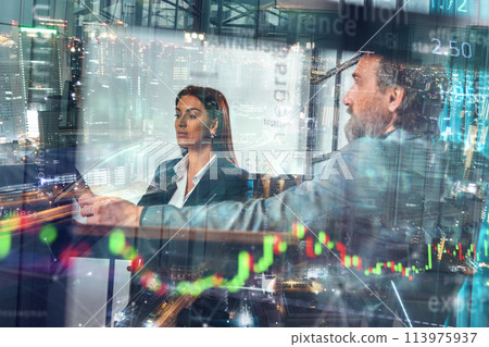 Businessman works on trading stock market chart on a computer 113975937