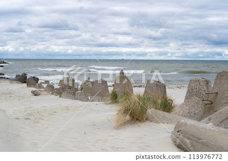 Storm on Baltic Sea. Breakwaters. Tetrapods. Baltiysk 113976772