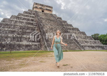 Beautiful tourist woman observing the old pyramid and temple of the castle of the Mayan architecture known as Chichen Itza these are the ruins of this ancient pre-columbian civilization and part of 113976918