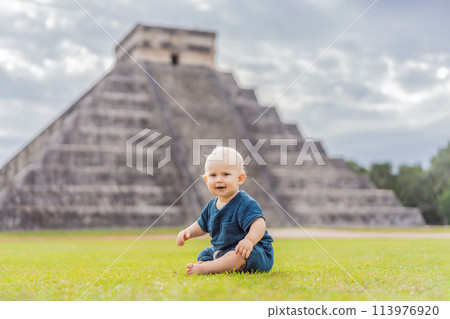 Baby traveler, tourists observing the old pyramid and temple of the castle of the Mayan architecture known as Chichen Itza these are the ruins of this ancient pre-columbian civilization and part of 113976920