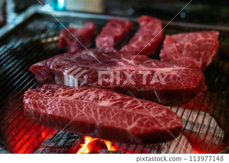 Hanwoo Beef, Korean Style Meat on the Grill. BBQ rare meat with soft focus Hanwoo Beef, Korean Style Meat on the Grill. BBQ rare meat with soft focus 113977148