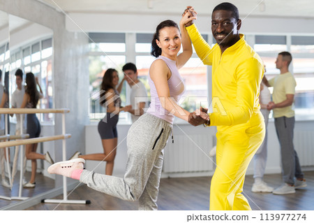 Couple adult woman and man dancing twist 113977274
