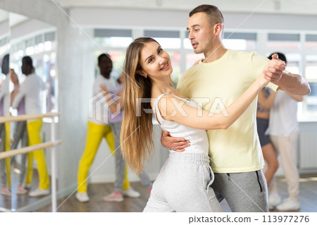 Couple young woman and man dancing waltz Couple young woman and man dancing waltz 113977276