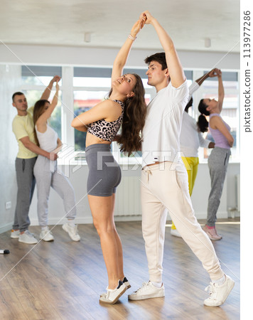 Couple young woman and man dancing waltz Couple young woman and man dancing waltz 113977286