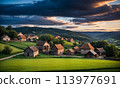 Panoramic top view of an old small abandoned ruined village on the hills with thatched roof huts at sunset with clouds in the sky 113977691