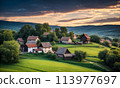 Panoramic top view of an old small abandoned ruined village on the hills with thatched roof huts at sunset with clouds in the sky 113977697