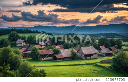 Panoramic top view of an old small abandoned ruined village on the hills with thatched roof huts at sunset with clouds in the sky Panoramic top view of an old small abandoned ruined village on the hills with thatched roof huts at sunset with clouds in the sky 113977703