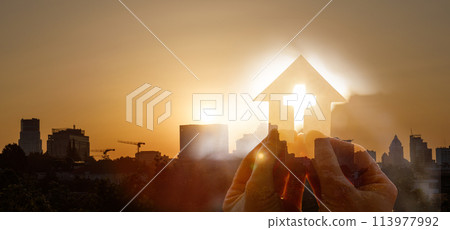 Double exposure of cut out paper church and city sunset. 113977992